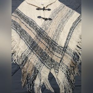 Beautiful poncho with toggle buttons and fringe